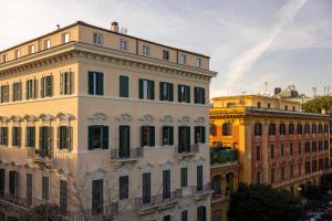 a group of buildings next to each other at Boutique Hotel Maria Vittoria in Rome +80 photos