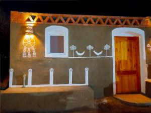 a model of a house with a door and a window at ASSINGAR Island in Aswan