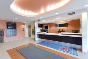 a lobby of a hospital with a sign on the floor at Motel 6-Brandon, MB in Brandon