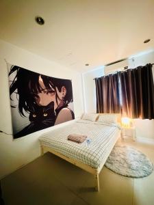 En eller flere senge i et værelse på HulaFling Homestay