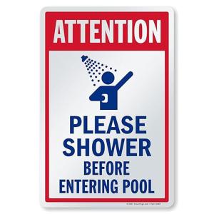 a sign that reads please shower before entering pool at Angkorian Hostel in Phumi Ta Phul