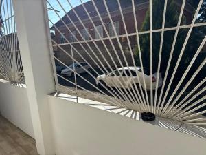 een glazen raam met een auto in een gebouw bij Spacious 2-Bed Apartment in City Center with Free Parking & Balcony in Lankaran