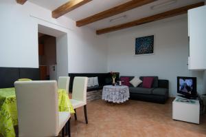 a living room with a couch and a table at Apartment Tomic A-5 in Lovran
