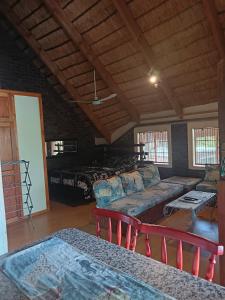 a living room with a couch and a table at Do Drop In in Hoedspruit