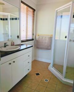 a bathroom with a sink and a shower at Terrace River House in Caddys Island
