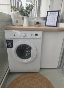 a washing machine in a room with a counter at Monzubi Etxi Holiday Home Gernika-Lumo in Guernica y Luno