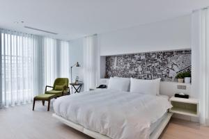 Postel nebo postele na pokoji v ubytování Hotel Mapp