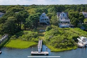 an aerial view of a house on an island in the water at Serene waterfront getaway in Mashpee