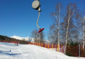 a person on a ski slope with a snowboard in the air at Albergo Genzianella in Careggine +35 photos