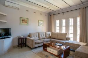 a living room with a couch and a coffee table at Kadoma Hotel & Conference Centre in Kadoma
