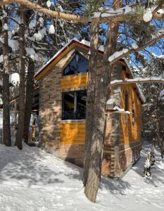 a log cabin in the woods in the snow at Arte Jermuk #3 in Jermuk