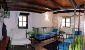 a room with a bed and a table and a chair at Albergue Rural Montebaserria in Ziortza-Bolibar