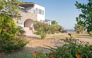 a villa with a view of the ocean at Anemes in Avlemonas