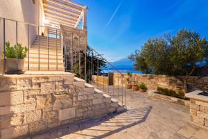 a set of stairs leading up to a house at Villa Aries in Supetar +45 photos