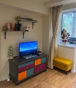 Et tv og/eller underholdning på Chamkoria Forest View & Spa Apartment