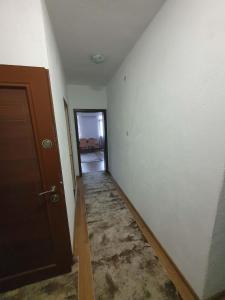 an empty room with a door and a hallway at Levkov in Petrich +18 photos