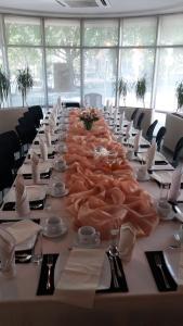 a long table with a large group of animals on it at Hotel Blick in Gdynia