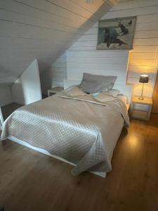 a bedroom with a large bed in a attic at Brinken 3 in Sörberge
