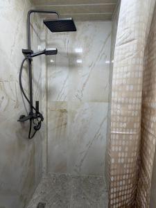 a bathroom with a shower with a glass door at Arte Jermuk #3 in Jermuk +7 photos