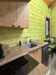 a kitchen with a sink and a stove at Arte Jermuk #3 in Jermuk