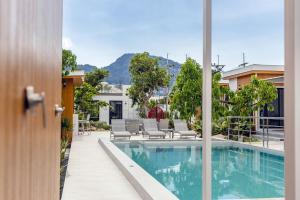 a view of a swimming pool from a house at Zana Villas in Krabi