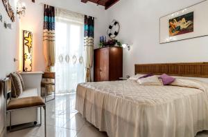 Postel nebo postele na pokoji v ubytování Il Veliero B&B