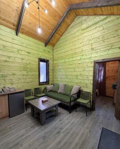 a living room with a couch and a table at Arte Jermuk #3 in Jermuk