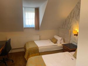 Tempat tidur dalam kamar di In Piazza