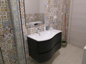 a bathroom with a sink and a shower at Casa di Biagio e Maria in Trecchina
