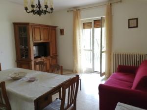 a living room with a table and a couch at Casa di Biagio e Maria in Trecchina