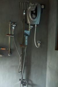 a bathroom with a shower in a room at Visit Wilpattu in Pahala Maragahawewa
