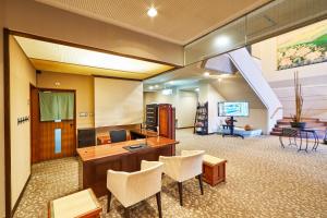 an office with a desk and chairs and a slide at Shiki Resorts Kusatsu Saisonnier in Kusatsu
