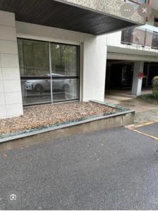 a car is reflected in the window of a building at ici ville d'histoire in Nevers +5 photos