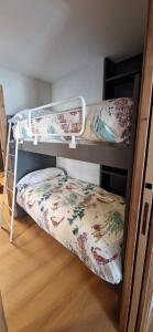 a bunk bed room with two bunk beds in a room at Valtour House in Valtournenche