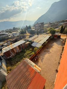an aerial view of a small town with a mountain at Hotel Royal Inn, Nuwakot in Trisūli Bāzār