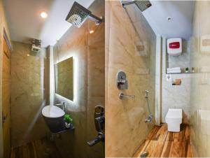a bathroom with a shower with a sink and a toilet at Hotel Ruhi Dx - Near New Delhi Railway Station & Connaught Place in New Delhi