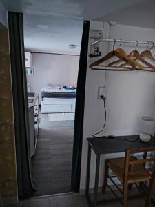 a room with a table and a room with a bed at bords de loire in Saint-Sébastien-sur-Loire
