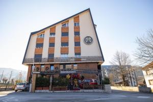 a building with a sign on the side of it at Mia's Modern Mountain in Kolašin