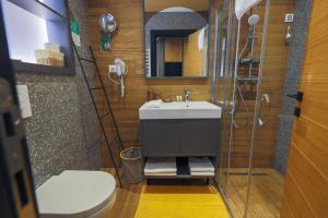 a bathroom with a sink and a shower and a toilet at Mia's Modern Mountain in Kolašin +27 photos