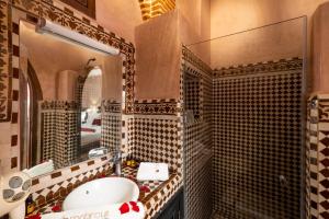 a bathroom with a sink and a mirror at Riad Mabrouk in Marrakesh +157 photos