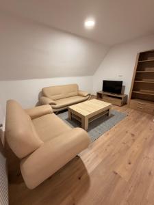 a living room with a couch and a coffee table at Workhome A2 zu 6 in Lünen