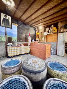 a room with several large tires in a room at Sudi Guest House in Pemuteran