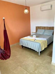 En eller flere senge i et værelse på Pousada Dunnas do Thyago - preços de inauguração - Praia de Caraúbas - Vista para o mar e para as dunas