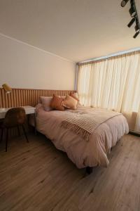 Giường trong phòng chung tại Elegancia Moderna en Altura