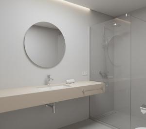 a bathroom with a sink and a mirror at Norvia Otel in Konya