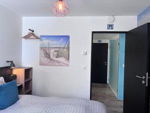 Giường trong phòng chung tại Chez Isa