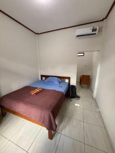 En eller flere senge i et værelse på Bertus GuestHouse