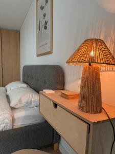 a lamp on a table next to a bed at Carsium View House in Hîrşova +38 photos