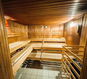a wooden sauna with wooden benches in a room at Apartment Rehblick Hohenwarth in Hohenwarth