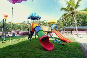 a playground with a slide at Hotel Yathra Athithya in Dharmastala